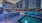 Spacious sparkling pool with sundecks and cabanas for lounging.